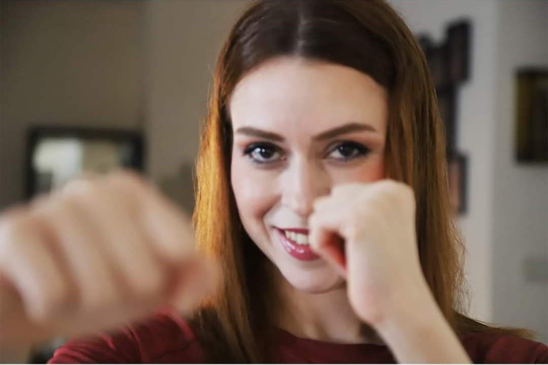 Nada Zaitoon, fists up, smiling